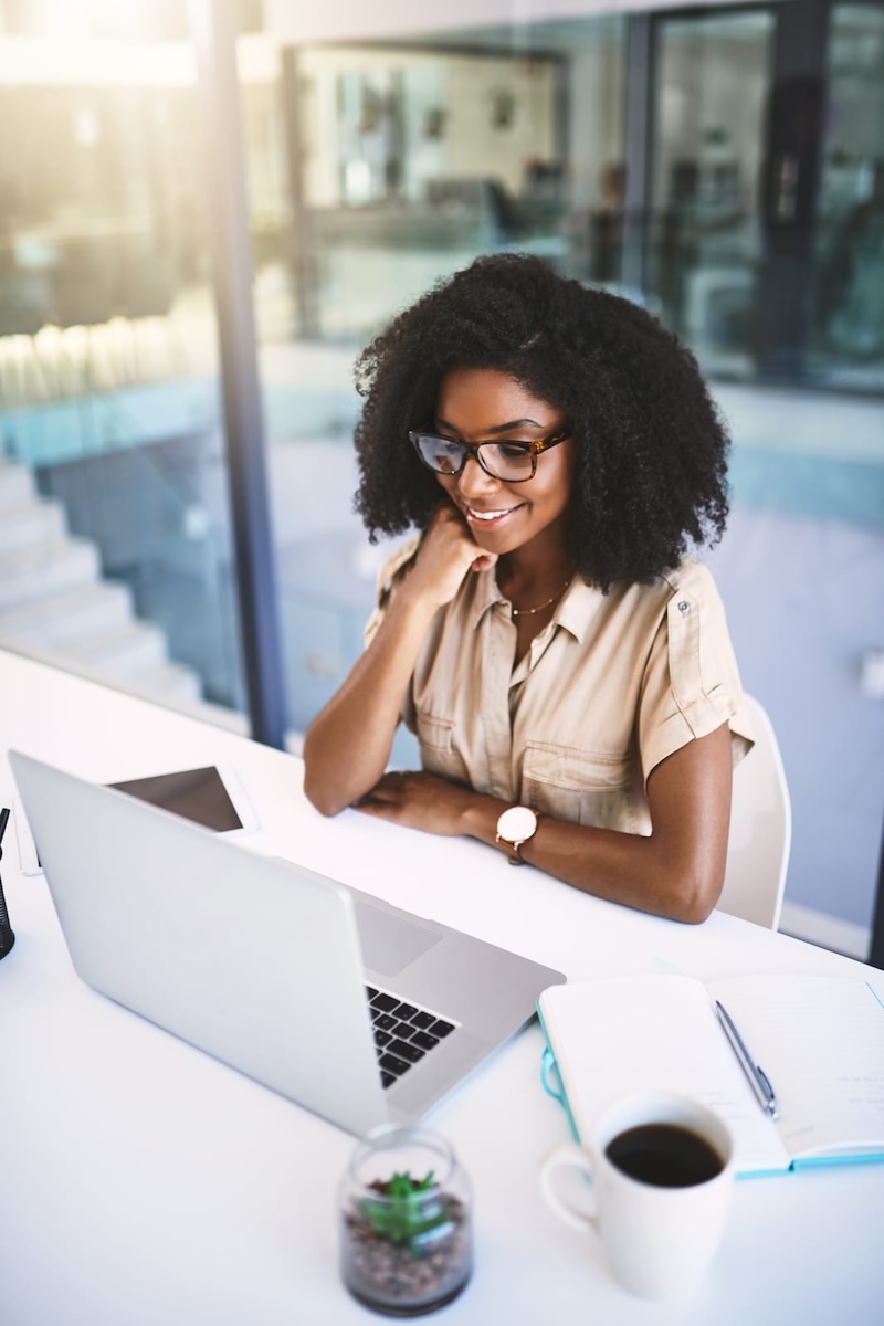 black woman using computer in office